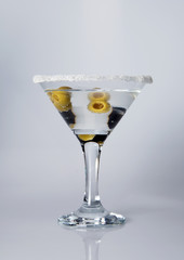 glass of martini with olives