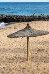 Straw umbrella on the beach