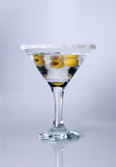 glass of martini with olives