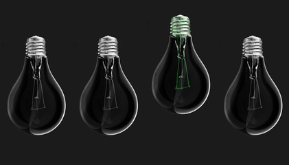 Green lightbulb among switched off lightbulbs on dark background