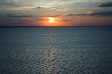 The setting sun in the Volga River