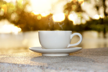Silhouettes of morning coffee on the lake.