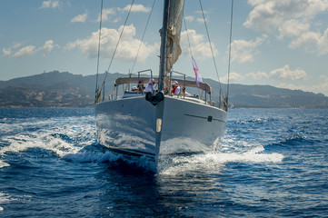 View on the bow of sailing yacht wich is cruising near Porto Cervo, Sardinia.