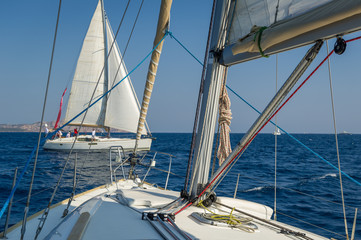 View from one sailing yacht deck to another cruising boat.