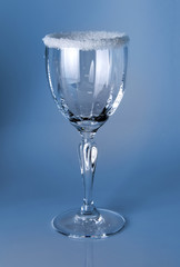 Wine glass close-up, decoration on the edge of a white crumb