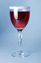 Wine glass close-up, decoration on the edge of a white crumb