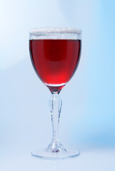 Wine glass close-up, decoration on the edge of a white crumb