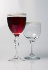 Wine glass close-up, decoration on the edge of a white crumb