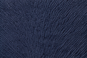 Dark blue background from soft textile material. Fabric with natural texture.