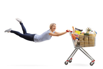 Woman being pulled by a shopping cart