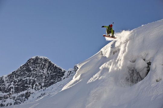 A young man splitboarding in the backcountry of Roger's Pass, Glacier National Park, British Columbia, Canada