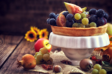 Autumn concept - Autumn fresh fruit on wooden background with copy space