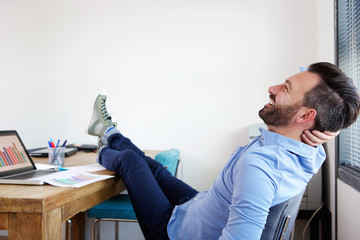 Fototapeta premium Mature business man relaxing in office