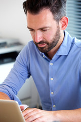 Fototapeta premium Mature man working on laptop