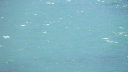 Colorful green water from the Inn river flowing lit by the sunshine
