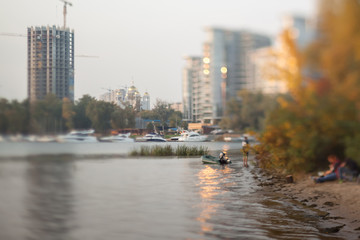 Fototapeta premium Evening on the autumn beach. Natural optical tilt shift photo.