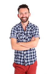 Stylish mature man standing with arms crossed and smiling