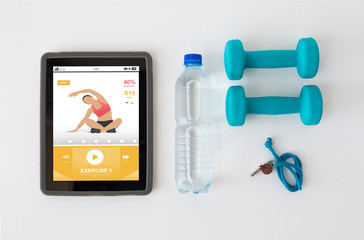 tablet pc, dumbbells, whistle and water bottle