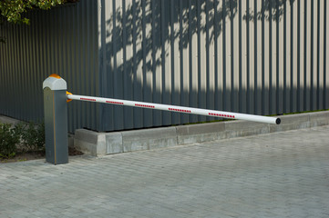 A small gate at the entrance to the parking area.
