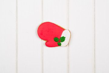 Christmas gingerbread on white wooden background. Space for text