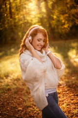 beautiful woman listening to music on headphones