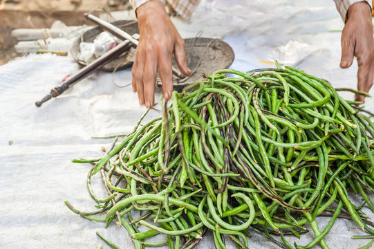 Organic local yard long beans for sale at outdoor asian marketplace
