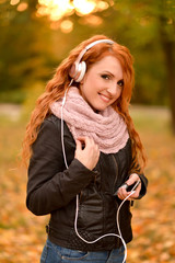 beautiful woman listening to music on headphones