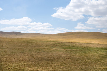 blue sky over the vast Mongolian steppes