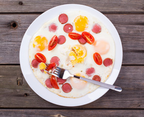 Fried eggs with sausage slices