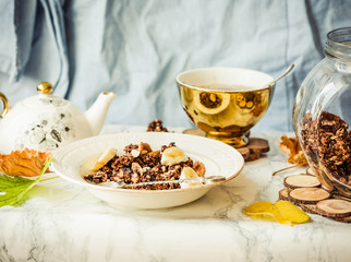 Homemade сhocolate granola with banana and peanut butter