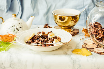 Homemade сhocolate granola with banana and peanut butter