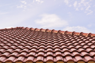 Roof tiles horizontal view against blue sky