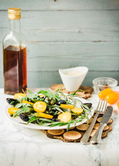 green salad with arugula, yellow tomatoes,grapes, sesame, select