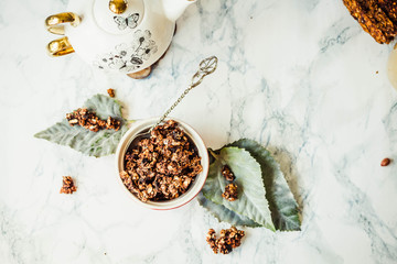 Chocolate homemade granola with peanut butter and pear