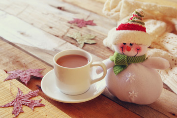White cup with hot chocolate and snowman