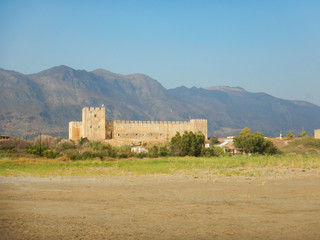 Fototapeta na wymiar The Medieval castle of Frangokastello, with mountains in the background, Crete, Greece