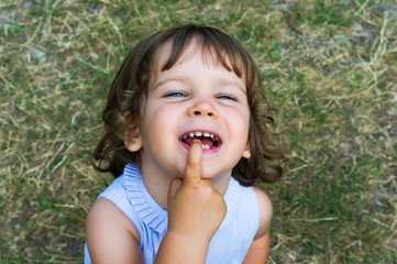 Cute young girl grinning and being silly