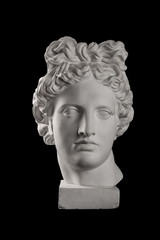 Gypsum statue of Apollo's head on a black background