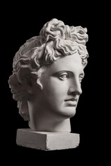 Fototapeta Gypsum statue of Apollo's head on a black background obraz