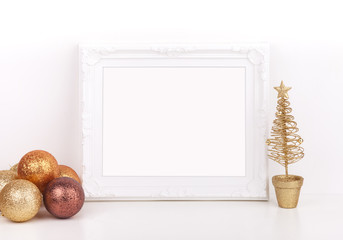 Christmas mockup styled stock photography, white ornate frame, gold glitter baubles with a gold...