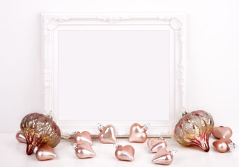 Christmas styled stock photography with white frame and pink baubles for your own business message,...