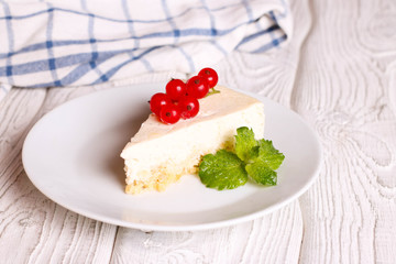 Slice of Plain New York Cheesecake on white plate