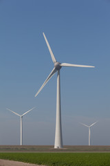 Fototapeta premium Windturbines producing alternative energy