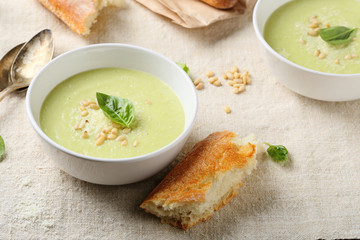 Soup and fresh bread on table