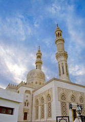 Fototapeta na wymiar Tower minaret against a bright sky, Egypt.photo toned