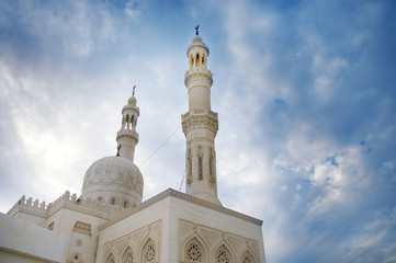 Fototapeta na wymiar Tower minaret against a bright sky, Egypt.photo toned