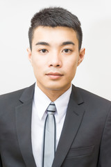 Portrait of asian businessman in black suit