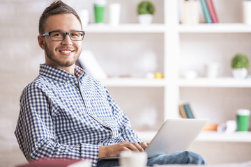 Caucasian guy using laptop