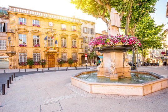 Fototapeta City hall building with fountain in Salon-de-Provence in France