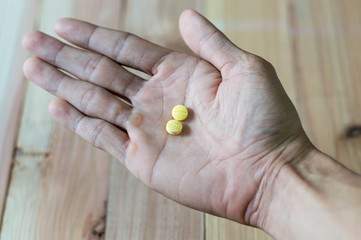Pills in hand, selective focus